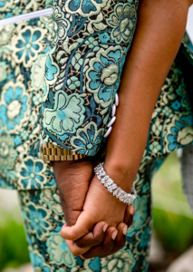 Bride and Groom holding hands, close up on hands