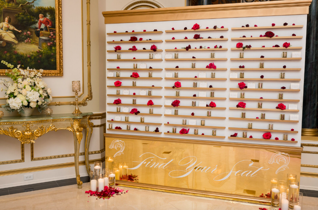 Find Your Seat wedding placecard wall, red roses