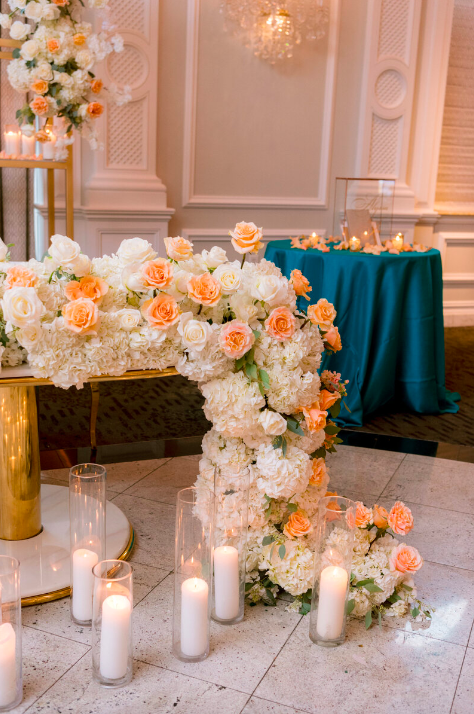 Sweetheart table at wedding, white and peach flowers